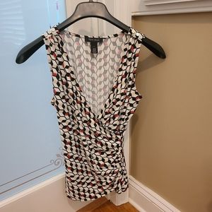 White House Black Market Sleeveless. White with geometric shapes. Size small